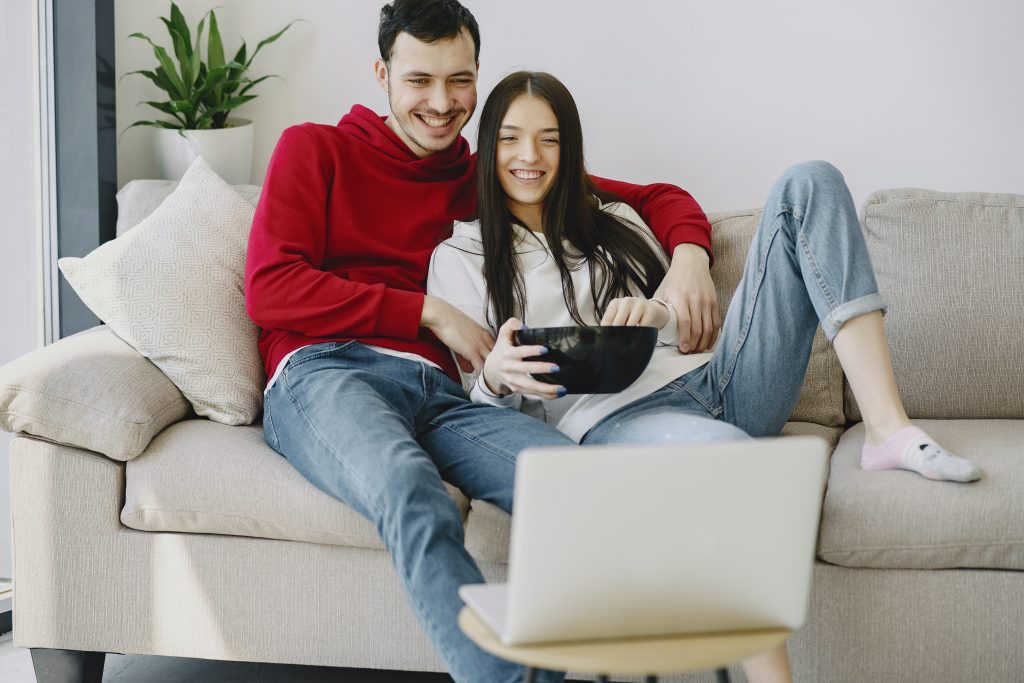 romantic films - couple watching film on laptop